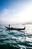  Gondolier in the fog overlooking the Giudecca, Venice, Veneto, Italy 