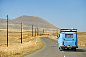 road to Sevan Lake through the Argitchi plateau, with Armaghan volcano in the background, Gegharkunik region, Armenia, Eurasia