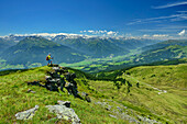  Man hiking standing on Maurerkogel with Salzach Valley in the background, Maurerkogel, Pinzgauer Höhenweg, Kitzbühel Alps, Salzburg, Austria 