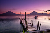 Traditional moorings and volcanoes of Atitlan 3537 m. and San Pedro 3020 m. Lake Atitlan, Sololá Department, Republic of Guatemala, Central America