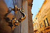 door knocker on a side door of the Torresaura Palace on Major Des Born Street, Ciutadella de Menorca, Menorca, Balearic Islands, Spain, Europe