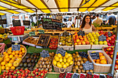  Saleswoman at her stand with fruit at the market in La Rochelle, France, Europe 