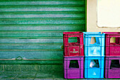  Beer crates in front of a roller shutter, colour-shifted on Lam Gomera, Spain 