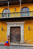 Palenque woman selling fruits in downtown colonial walled city, Cartagena, Colombia, South America