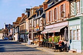  Main street with half-timbered houses in Beuvron-en-Auge in the Pays d&#39;Auge in the Calvados department in the Normandy region of France 