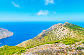 View of Prophet Elias Monastery perched on the top of Sifnos Island northern coast, Sifnos Island, Cyclades Islands, Greece