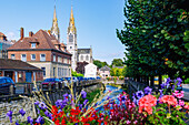  Bridge over the river Vie and view of the neo-Gothic church Notre-Dame in Vimoutiers in the Pays d&#39;Auge in the Calvados department in the Normandy region of France 