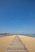  Plaža Ždrijac, a beach surrounded by the sea on both sides. A wooden pier runs through the middle, Nin, Zadar, Dalmatia, Croatia 