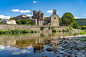  The Sainte-Marie-Madeleine church, Chateau de Laroque castle and the Hérault river in Laroque, France, Europe 