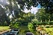  Hortillonnages (floating gardens) with boats for boat tours through the water labyrinth of allotment gardens in Amiens in the Somme department in the Hauts-de-France region of France 