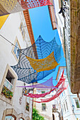 Old town street decorated with Portuguese artefacts, Coimbra, Coimbra district, Centro Region, Portugal