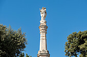 The votive column with statue of the Blessed Virgin of Mount Carmel atop in Mesagne, Puglia, Italy.