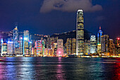 Iconic view of the Central Waterfront skyscrapers illuminated at night. Hong Kong, China.