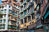 Facades of multi-storey residential buildings at the Rotunda De Carlos Da Maia square. Macau, China.