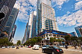 View of the street traffic and high-rise modern buildings in the Futian Central Business District (CBD). Shenzhen, Guangdong Province, China.