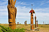 sculptures of angels made of oak wood on the Hill of Angels, marking the Millenium of the Lithuania's name and 600-years anniversary of the Trakai Church of the Visitation of \nthe Blessed Virgin Mary, near Trakai, Lithuania, Europe