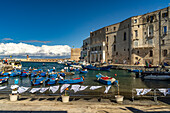  Blue fishing boats Gozzi in the Old Port of Monopoli, Apulia, Italy, Europe 