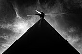 Wind Turbine with Sunlight and Against Sky with Clouds in a Sunny Summer Day in Andermatt, Uri, Switzerland.