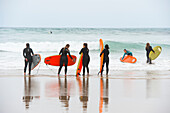 surf class on Zurriola beach, district of Gros, San Sebastian, Bay of Biscay, province of Gipuzkoa, Basque Country, Spain,Europe