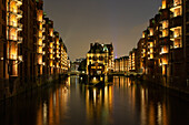  View of the moated castle in the evening, Speicherstadt, Hanseatic City of Hamburg, Germany 