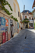 Old houses on a narrow street in Kritsa village, Crete, Greece.