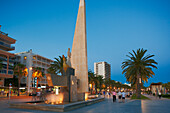 King Jaume I (James I) Monument on Passeig de Jaume I illuminated at dusk. Salou, Catalonia, Spain.