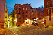 Elevated view of the Santiago Rossinyol Plaza illuminated at dusk in the old town of Tarragona, Catalonia, Spain.