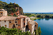 Old houses in Miravet village with Ebro river running below. Miravet, Catalonia, Spain.