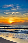 Scenic view of colorful sunrise skies and sea at the Mui Ne Beach. Mui Ne, Binh Thuan Province, Vietnam.