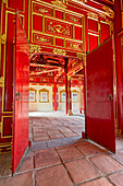 Interior view of the Can Thanh Palace (Emperor's Private Palace) with vivid red painting. Imperial City, Hue, Vietnam.