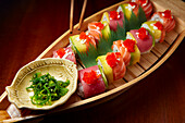 Rainbow Rolls (Tuna, Salmon, Crab, Cucumber, Tobico, Mayonnaise) served in a Japanese restaurant. Hue, Vietnam.