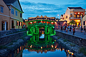 Exterior view of the Japanese Covered Bridge illuminated at dusk. Hoi An Ancient Town, Quang Nam Province, Vietnam.