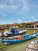 Traditional boats on the Thu Bon River in Hoi An Ancient Town. Hoi An, Quang Nam Province, Vietnam.