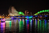 Dragon head on the Dragon Bridge (Cau Rong) breathes steam at night. Da Nang city, Vietnam.