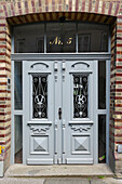  Artistic front door on a brick house 