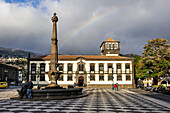 Stormy sky and rainbow above the City Hall Square,Funchal,Madeira island,Atlantic Ocean,Portugal