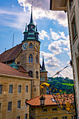 City Hall with Clock Tower with Statue in a Sunny Summer Day in Old Town in Fribourg, Canton Fribourg, Switzerland.