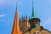 Cathedral Tower and House Tower in Old Town Medieval in a Sunny Summer Day in Fribourg, Canton Fribourg, Switzerland.