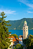 Cathedral Tower and City and Lake Lugano with Mountain and Blue Sky in a Sunny Summer Day in Lugano, Ticino, Switzerland.