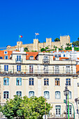  City views of streets in Lisbon near the Estatua Equestre de Dom Joao I with view of the Castelo de Jorge, Portugal 