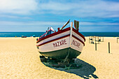  Nazaré is a Portuguese city on the Atlantic Ocean in the Oeste subregion of the Centro region and the historical province of Estremadura, about 100 km north of Lisbon, here fishing boats on the beach. 