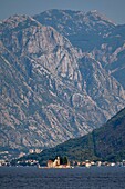  View of Bay of Kotor, Mountains of Kotor, Jezerski Vrh mountain, Montenegro, Crna Gora, island church Gospa od Škrpjela, sea, portrait format 