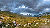  Viewpoint, tourist on wooden bench looks at the Durmitor mountain massif, Durmitor National Park, natural landscape, landscape, panoramic route, Montenegro, panorama 