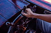  Close-up of captain&#39;s hand at the helm of a local sampan tour boat, Chau Phong, Tan Chau, An Giang, Vietnam, Asia 