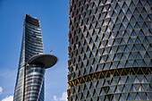  High-rise building under construction (has been lying idle as a ruin since 2013) with the Bitexco Financial Tower behind it, Ho Chi Minh City, Vietnam, Asia 