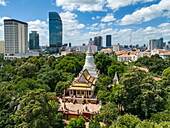  Aerial view of the hilltop temple Wat Phnom with skyscrapers in the distance, Daun Penh District, Phnom Penh, Cambodia, Asia 