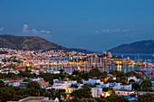 Scenic view of the coastal city of Bodrum illuminated at dusk. Bodrum, Mugla Province, Turkey.