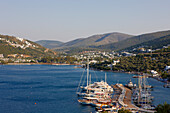 Elevated scenic view of Torba bay and harbor with moored boats. Torba village, Mugla Province, Turkey.