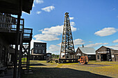 The Spindletop-Gladys City Boomtown Museum that features an oil derrick and many reconstructed Gladys City building interiors furnished with authentic artifacts from the Spindletop boomtown period, Beaumont, Texas, United States of America, North America