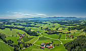  Aerial view of the Alpine foothills with Chiemsee and Chiemgau Alps in the background, Ratzinger Höhe, Chiemgau, Upper Bavaria, Bavaria, Germany 